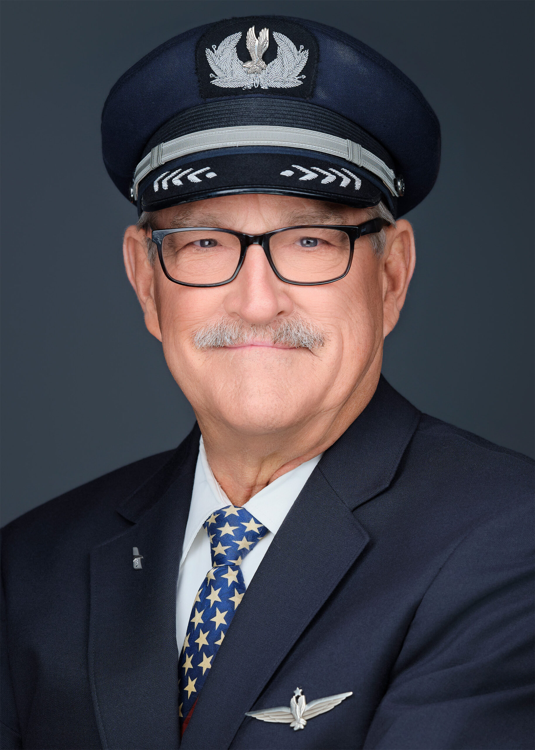 Executive portrait of a man in a charcoal blazer, photographed in Phoenix