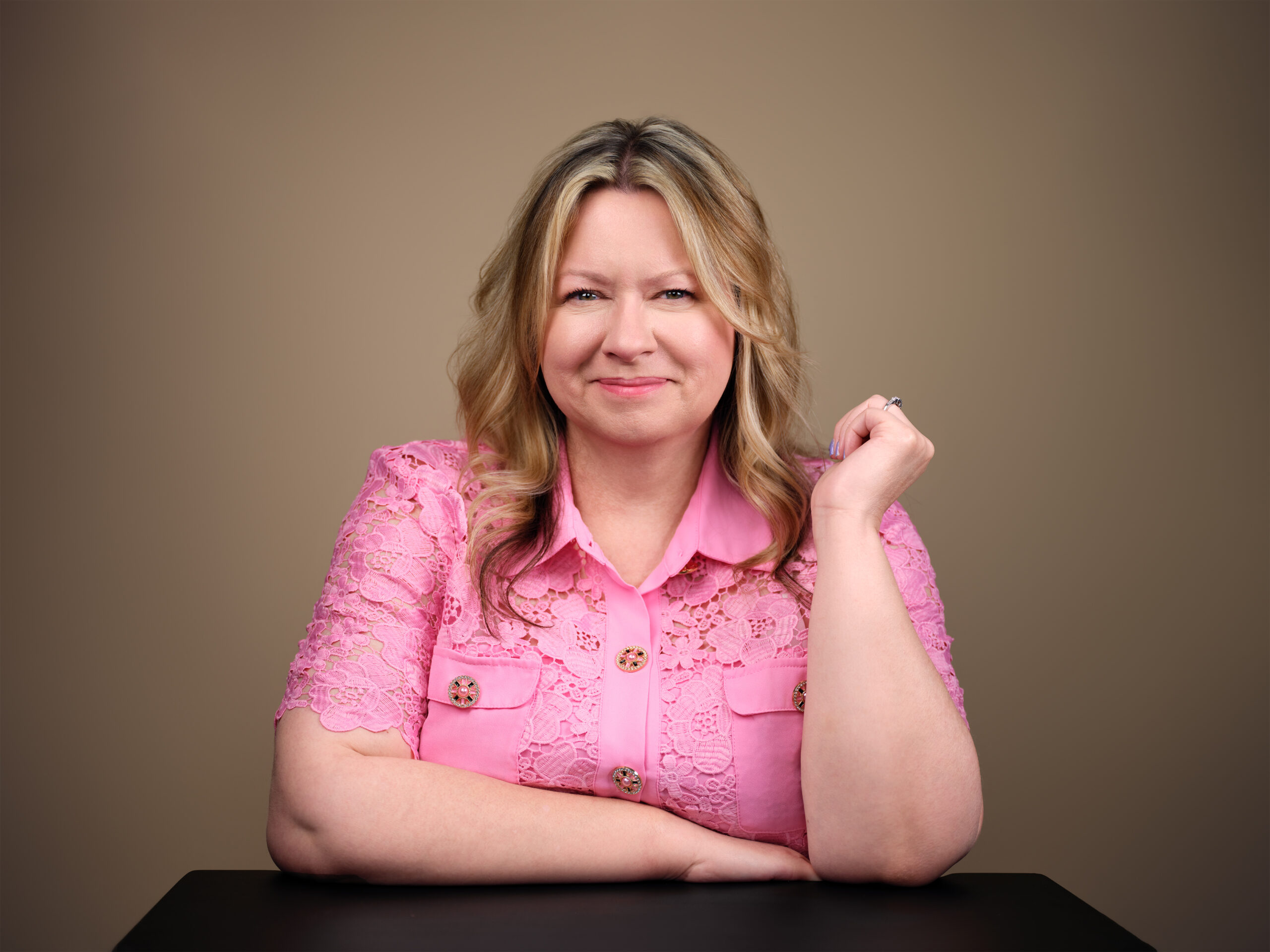 creative headshot of a female business owner wearing pink shirt in scottsdale studio