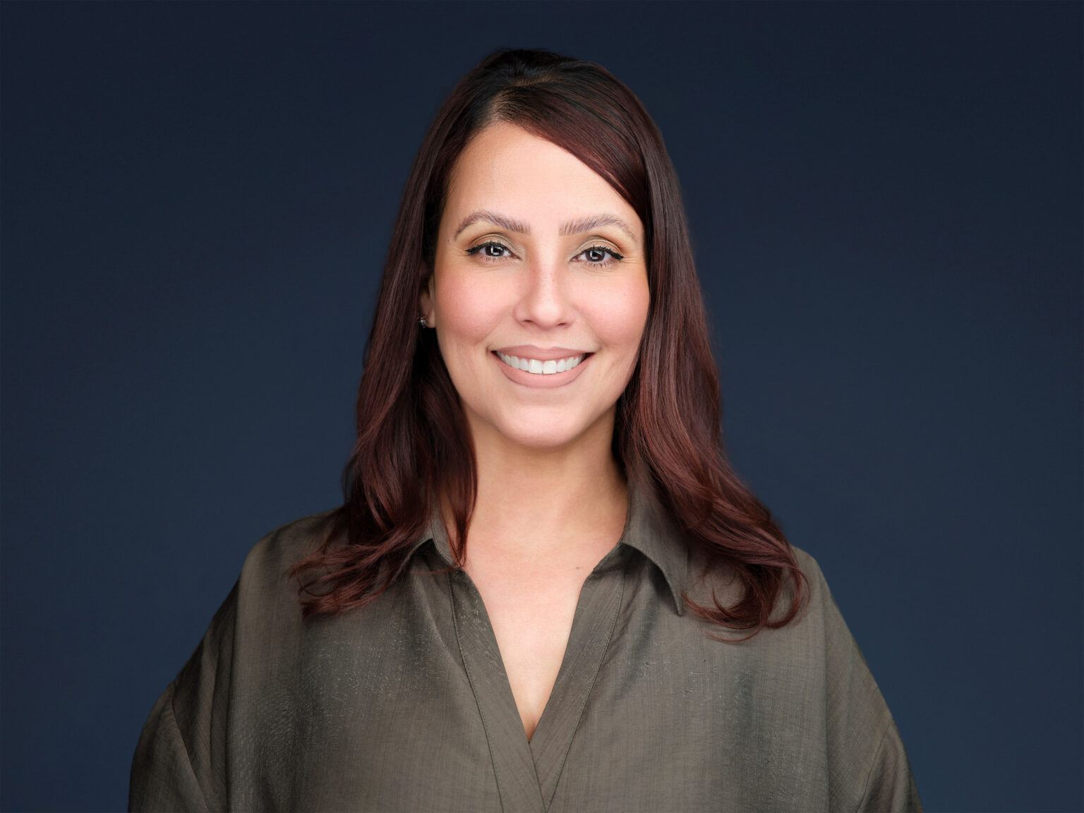 Confident business leader (female) portrait from team headshots by Duane Furlong Studios.