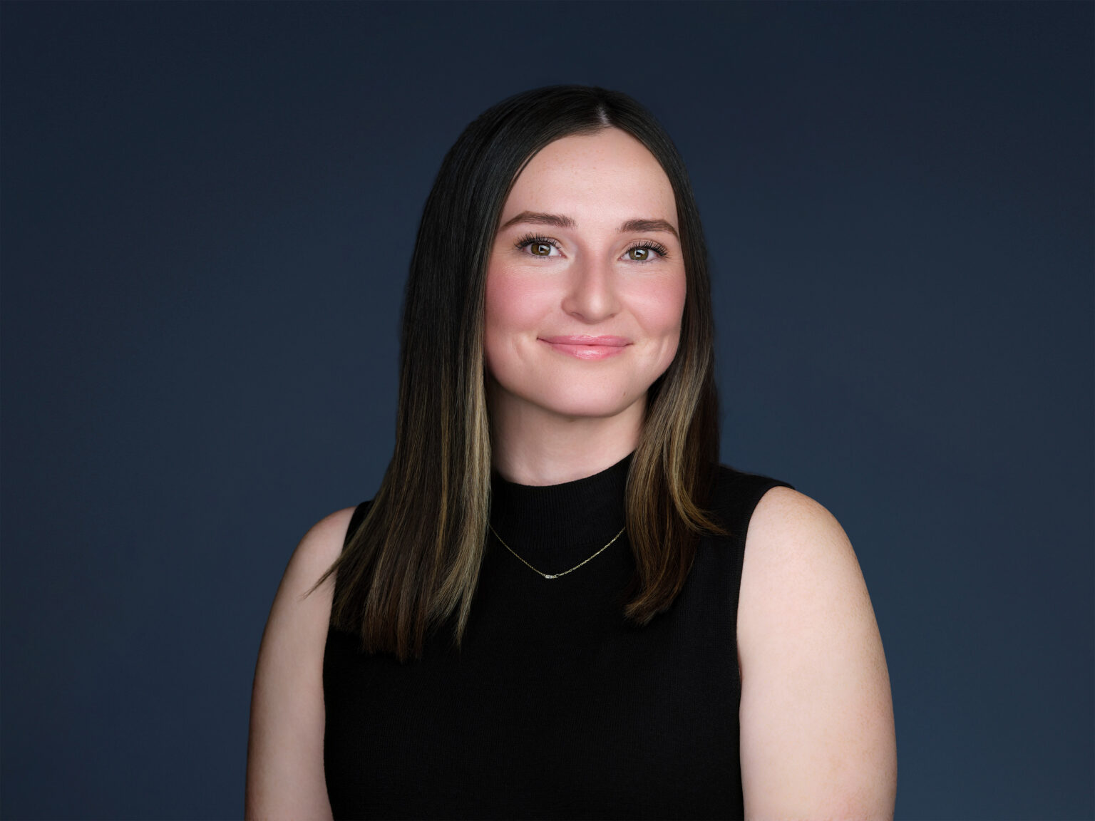 Female executive smiling in modern headshot, Duane Furlong Studios on-site Scottsdale service