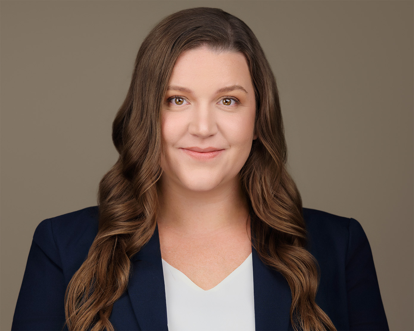 Corporate headshot of a woman in a black blazer, taken in our Scottsdale studio